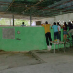 Apostadores de pelea de gallos en la gallera. Patrimonio cultural de Venezuela.